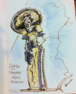 Clay Catrina on fireplace at Mask Museum.