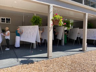 In-person Fundamentals of Visual Coaching class: all students at their easels practicing.